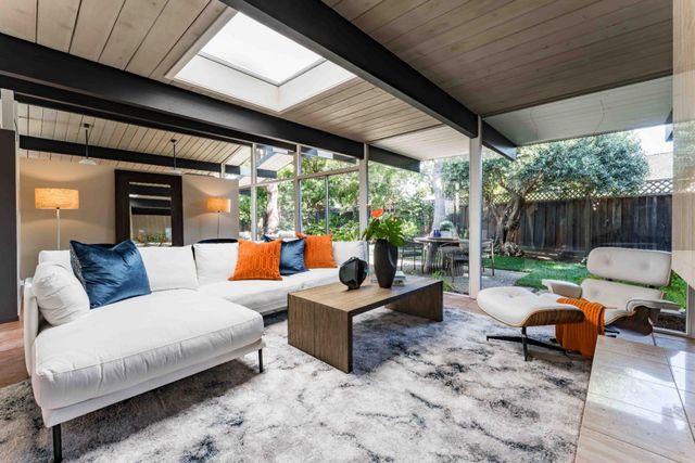 a outdoor space with patio couch and a wooden floor