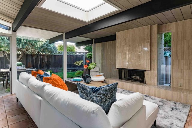 a outdoor living space with furniture and garden view