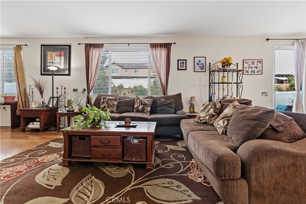 152 Alabaster Loop Perris, CA 92570 - Photo 12 of 29 a living room with furniture and a window