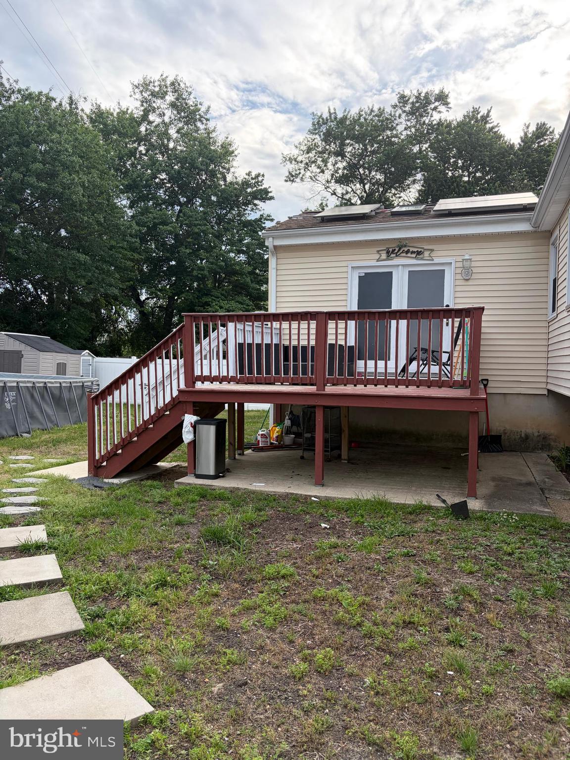 7404 Wyndam Road Pennsauken, NJ 08110 - Photo 49 of 50 a view of a house with a wooden deck and a yard