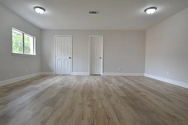 a bathroom with a toilet and a bathtub
