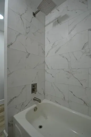 a bathroom with a sink vanity and mirror