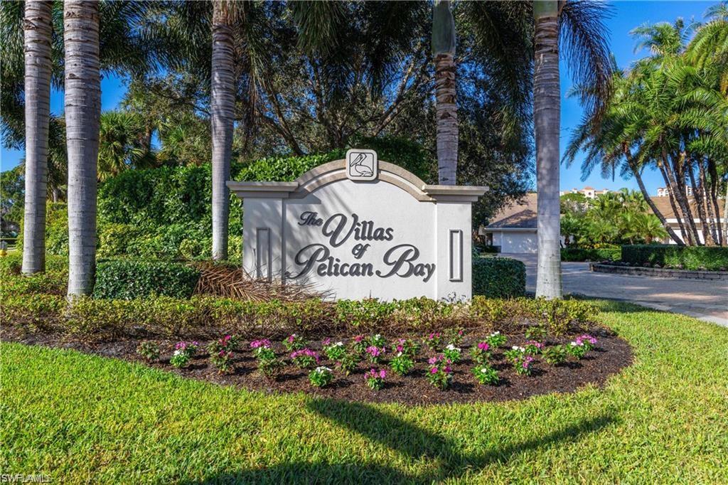 6624 Trident Way, Unit G5 Naples, FL 34108 - Photo 1 of 18 a sign that is in front of flowers