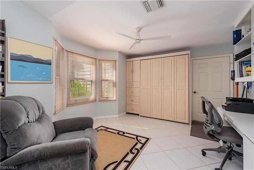 6624 Trident Way, Unit G5 Naples, FL 34108 - Photo 13 of 18 a living room with furniture and a window
