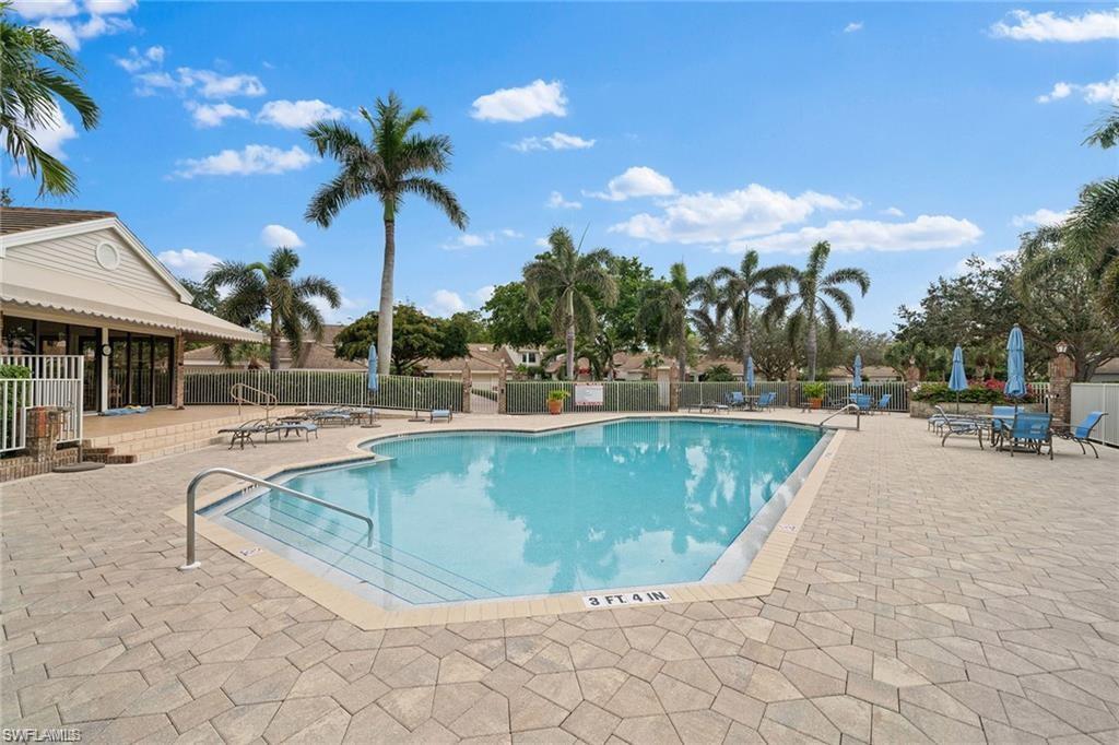 6624 Trident Way, Unit G5 Naples, FL 34108 - Photo 17 of 18 a view of outdoor space yard swimming pool and lounge chair