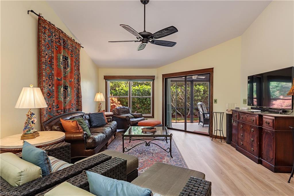 6624 Trident Way, Unit G5 Naples, FL 34108 - Photo 4 of 18 a living room with furniture and a flat screen tv