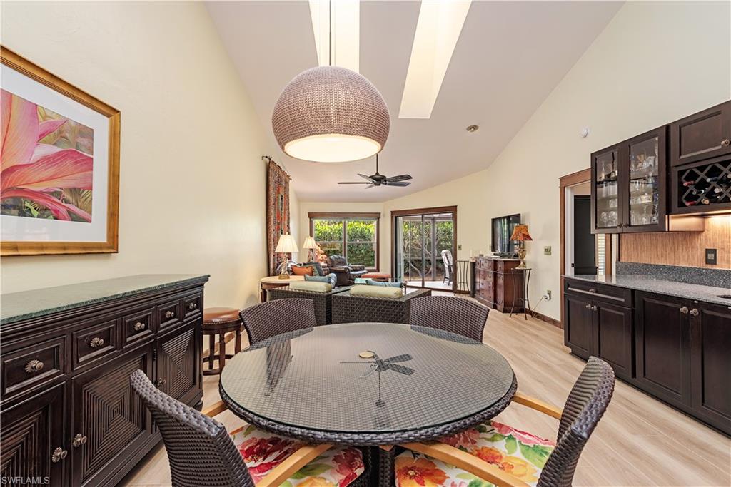 6624 Trident Way, Unit G5 Naples, FL 34108 - Photo 6 of 18 a view of a dining room with furniture window and wooden floor
