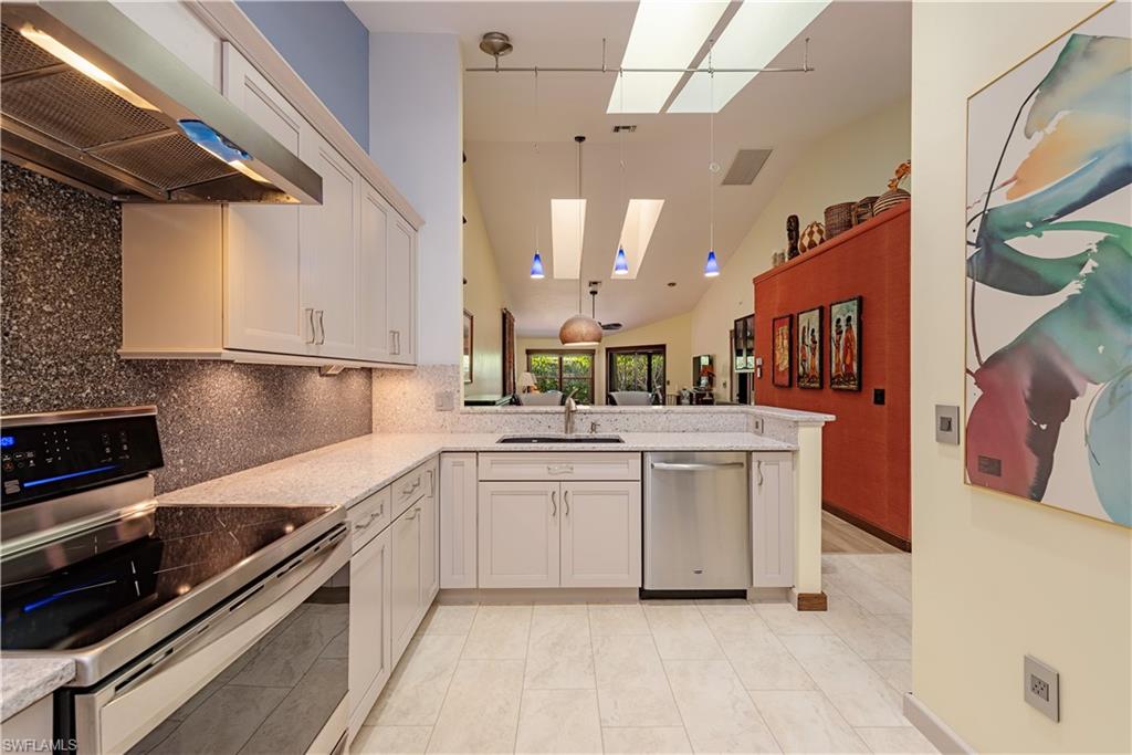 6624 Trident Way, Unit G5 Naples, FL 34108 - Photo 8 of 18 a kitchen with a sink stainless steel appliances and cabinets