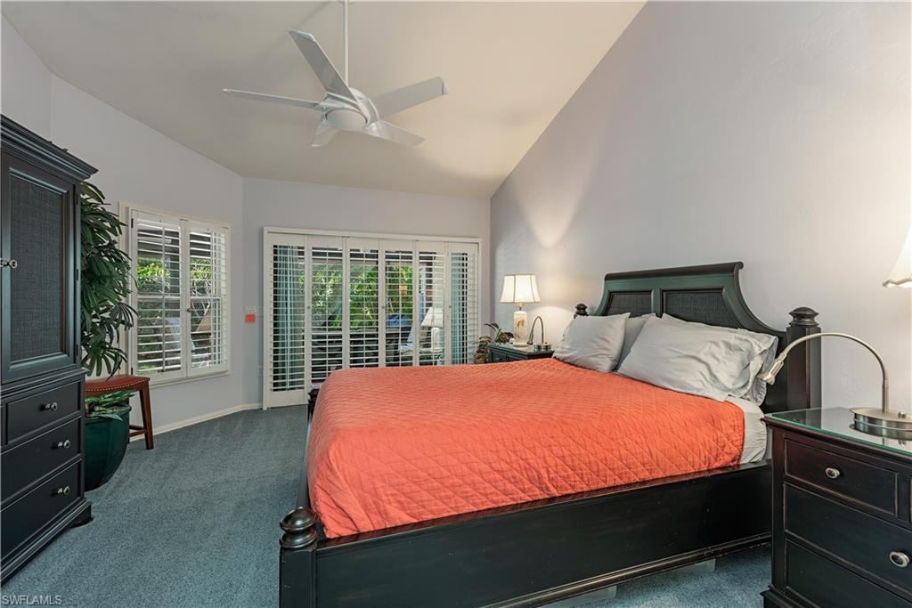 6624 Trident Way, Unit G5 Naples, FL 34108 - Photo 9 of 18 a bed sitting in a bedroom next to a window