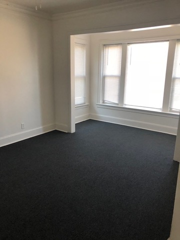 549 East 68th Street, Unit 1 Chicago, IL 60637 - Photo 5 of 8 an empty room with a window