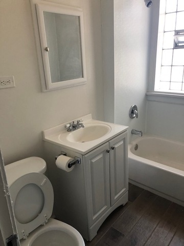 549 East 68th Street, Unit 1 Chicago, IL 60637 - Photo 8 of 8 a bathroom with a sink and a toilet