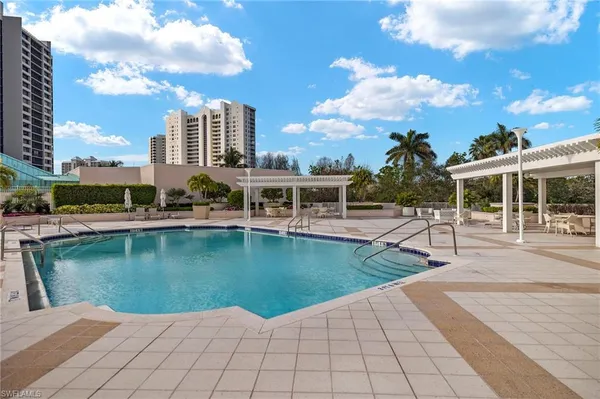 a view of a swimming pool with a lounge chairs