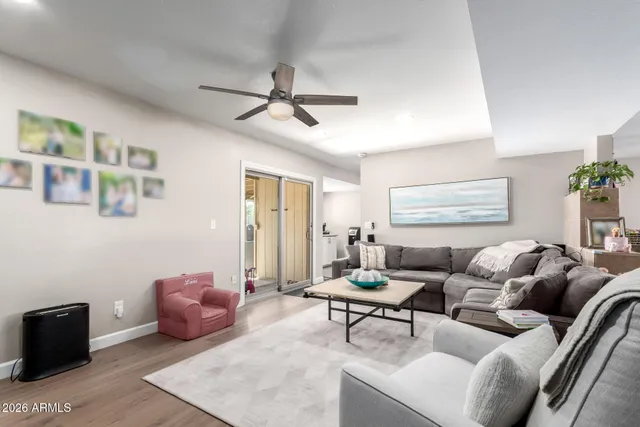 a living room with furniture and a window