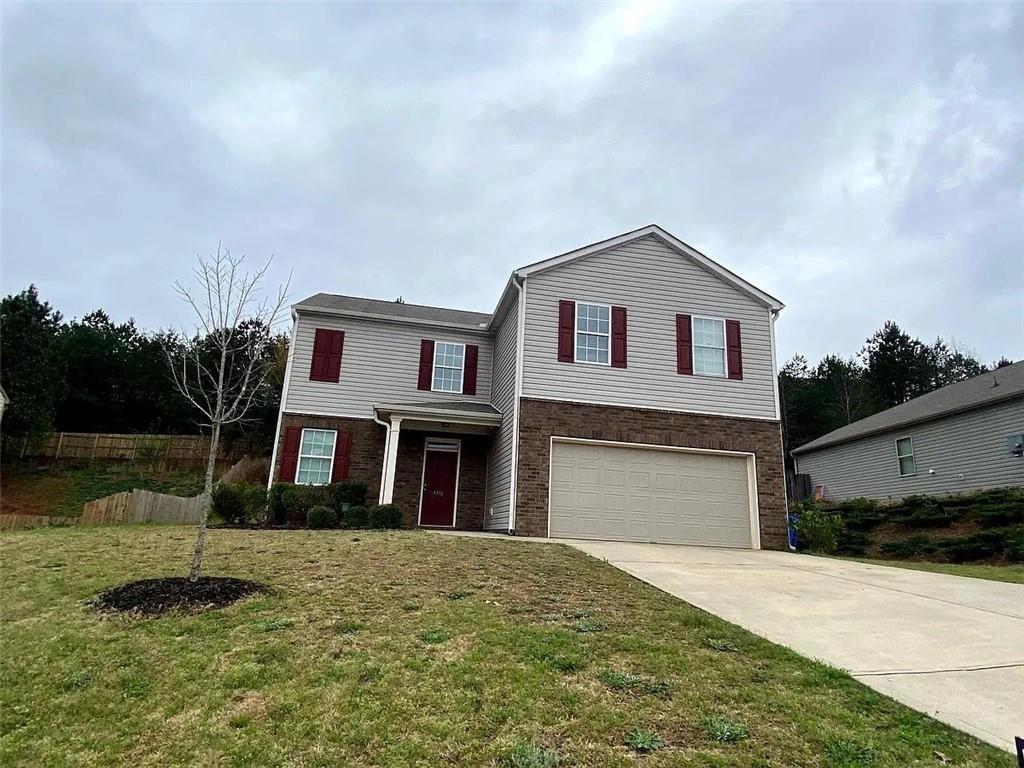 3110 Boxwood Crossing Gainesville, GA 30507 - Photo 1 of 15 a front view of a house with a yard