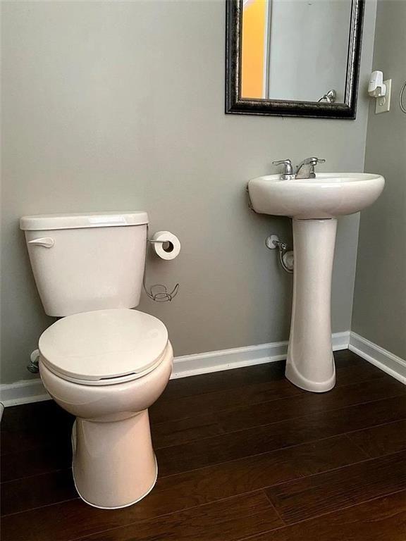 3110 Boxwood Crossing Gainesville, GA 30507 - Photo 7 of 15 a bathroom with a sink toilet and wooden floor