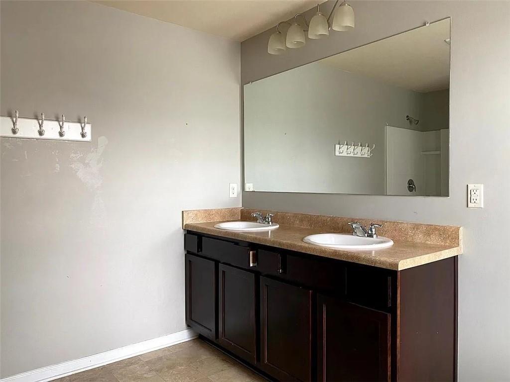 3110 Boxwood Crossing Gainesville, GA 30507 - Photo 10 of 15 a bathroom with a double vanity sink and mirror