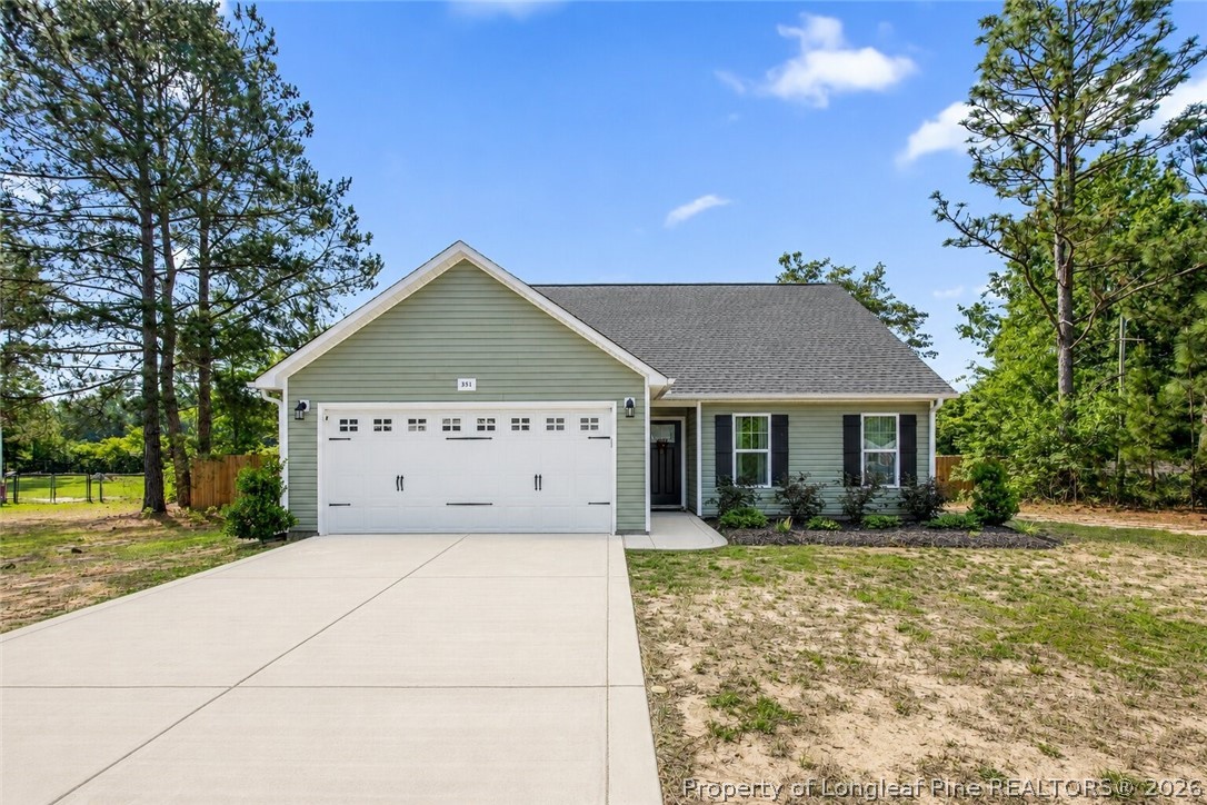 351 Sandy Grove Road Parkton, NC 28371 - Photo 1 of 30 a front view of house with yard and trees around