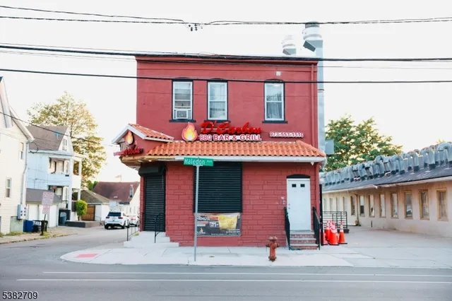 a front view of a building with traffic signal lights