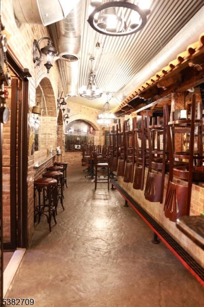 237 Haledon Avenue Haledon, NJ 07508 - Photo 12 of 49 a view of a patio with a table and chairs