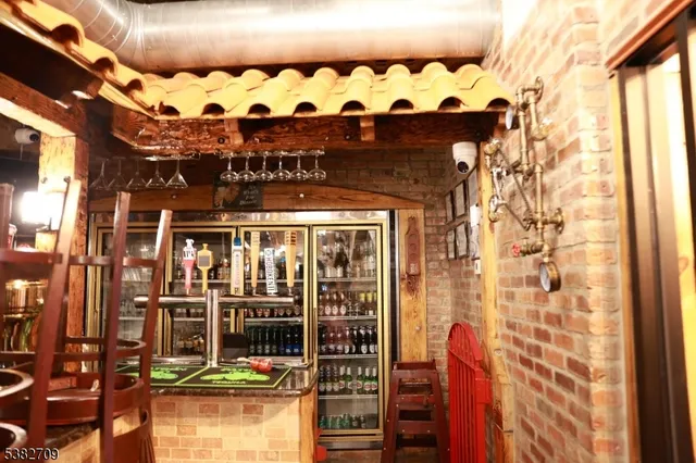a view of a room with lots of wooden furniture