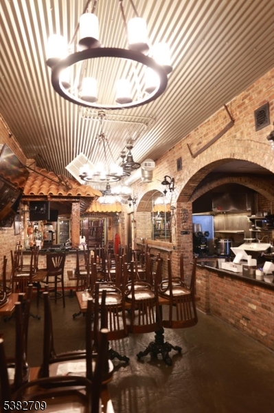 237 Haledon Avenue Haledon, NJ 07508 - Photo 17 of 49 a view of a chairs and tables in patio