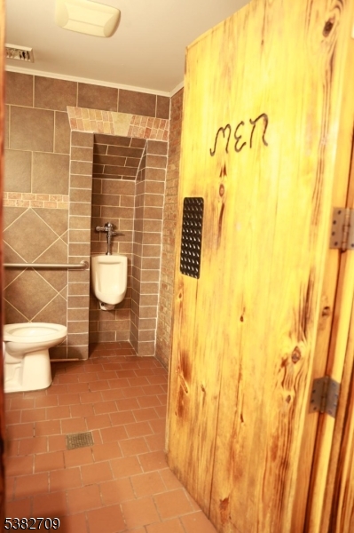 237 Haledon Avenue Haledon, NJ 07508 - Photo 23 of 49 a bathroom with a toilet and a shower