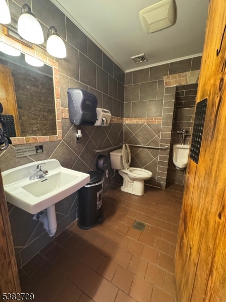 237 Haledon Avenue Haledon, NJ 07508 - Photo 24 of 49 a bathroom with a sink toilet and shower