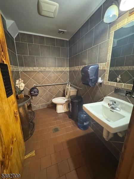 237 Haledon Avenue Haledon, NJ 07508 - Photo 25 of 49 a bathroom with a sink and a mirror