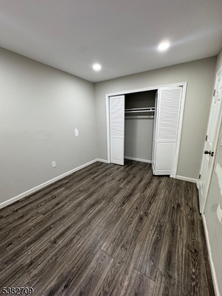 237 Haledon Avenue Haledon, NJ 07508 - Photo 35 of 49 a view of an empty room with wooden floor and closet