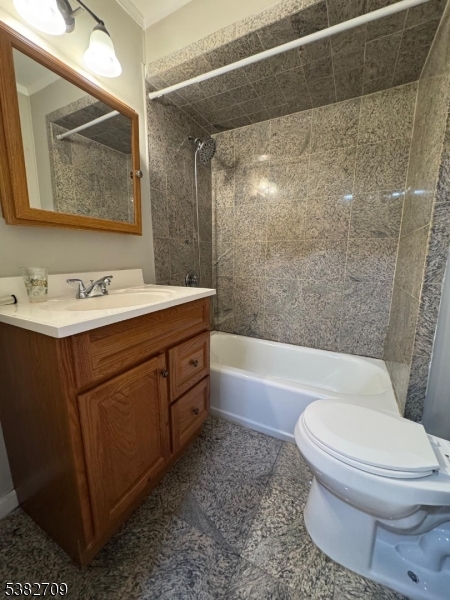 237 Haledon Avenue Haledon, NJ 07508 - Photo 36 of 49 a bathroom with a sink a toilet and bathtub