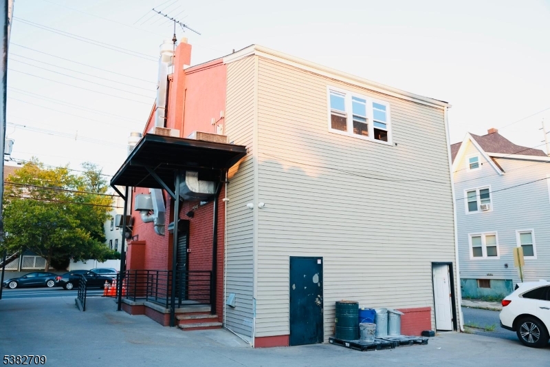 237 Haledon Avenue Haledon, NJ 07508 - Photo 4 of 49 a car parked in front of a house