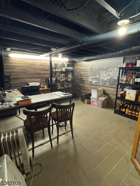 237 Haledon Avenue Haledon, NJ 07508 - Photo 48 of 49 a outdoor dining space with furniture and umbrella