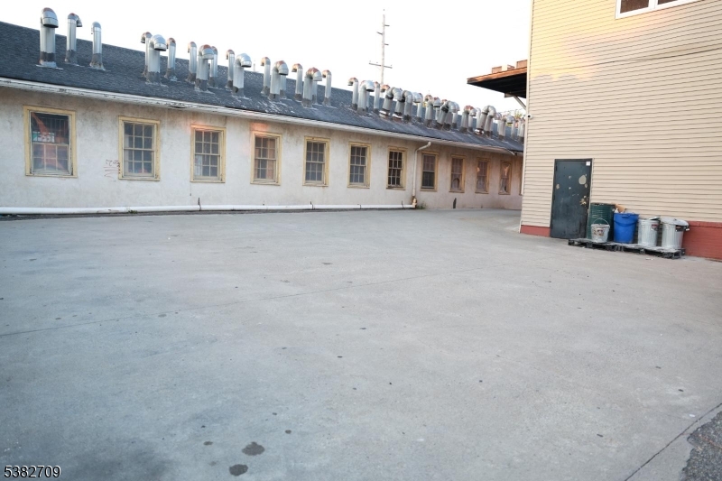 237 Haledon Avenue Haledon, NJ 07508 - Photo 7 of 49 a view of a house with a outdoor space