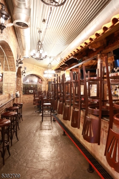 237 Haledon Avenue Haledon, NJ 07508 - Photo 10 of 49 a view of a chairs and table on the terrace