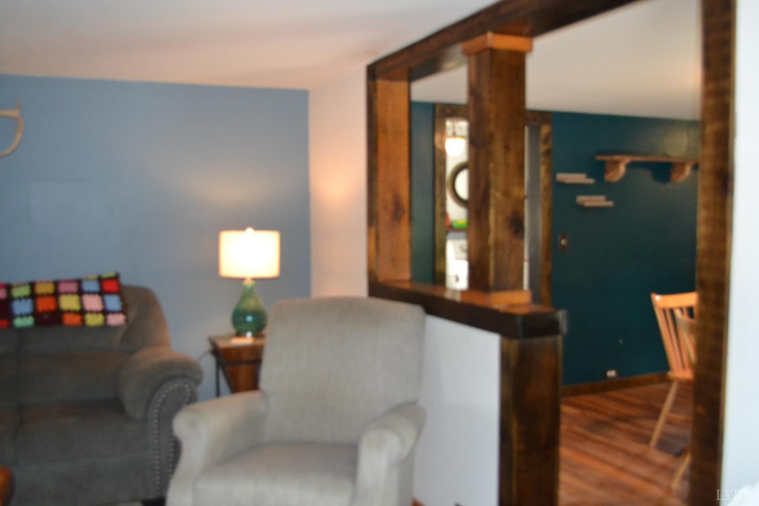 6387 Red House Road Rustburg, VA 24588 - Photo 17 of 38 a living room with furniture and a window