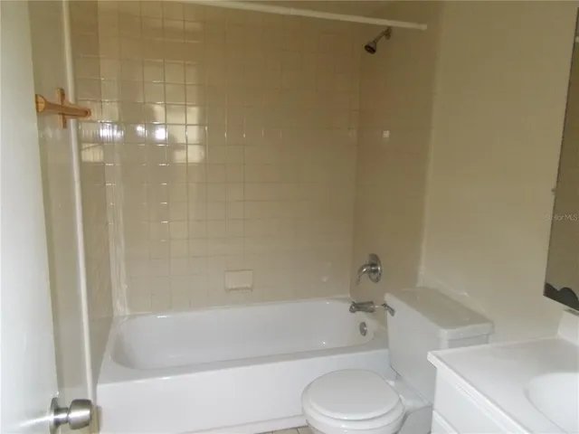 a bathroom with a bathtub and a toilet