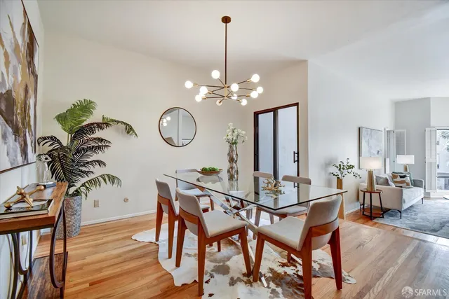 a living room with fireplace furniture and a wooden floor