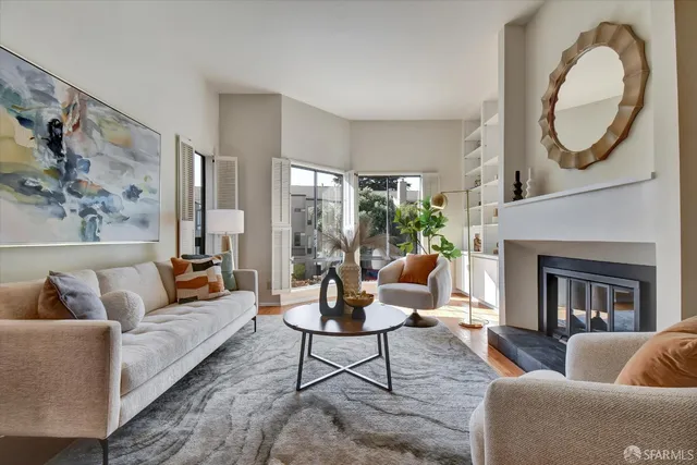 a living room with furniture and a fireplace