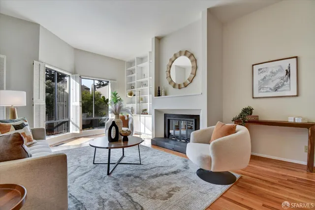 a living room with furniture and a lamp