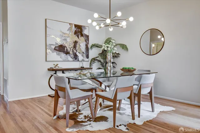 a balcony with furniture and a potted plant