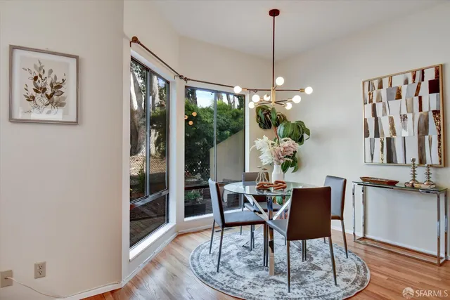a kitchen with stainless steel appliances granite countertop a sink and a refrigerator