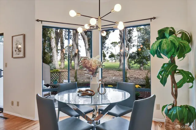 a kitchen with sink refrigerator and cabinets