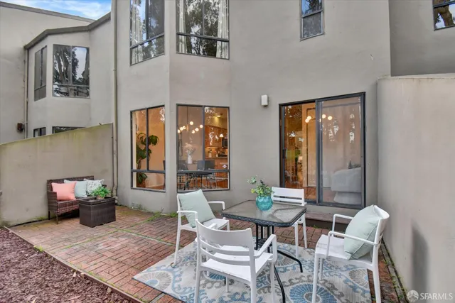 a bedroom with a large bed and a large window