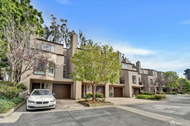 a view of a dining room with furniture wooden floor and chandelier