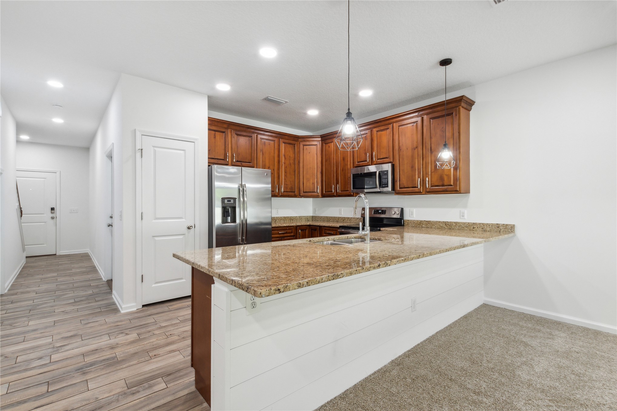 87279 Lents Road Yulee, FL 32097 - Photo 6 of 40 a kitchen with a sink appliances and cabinets