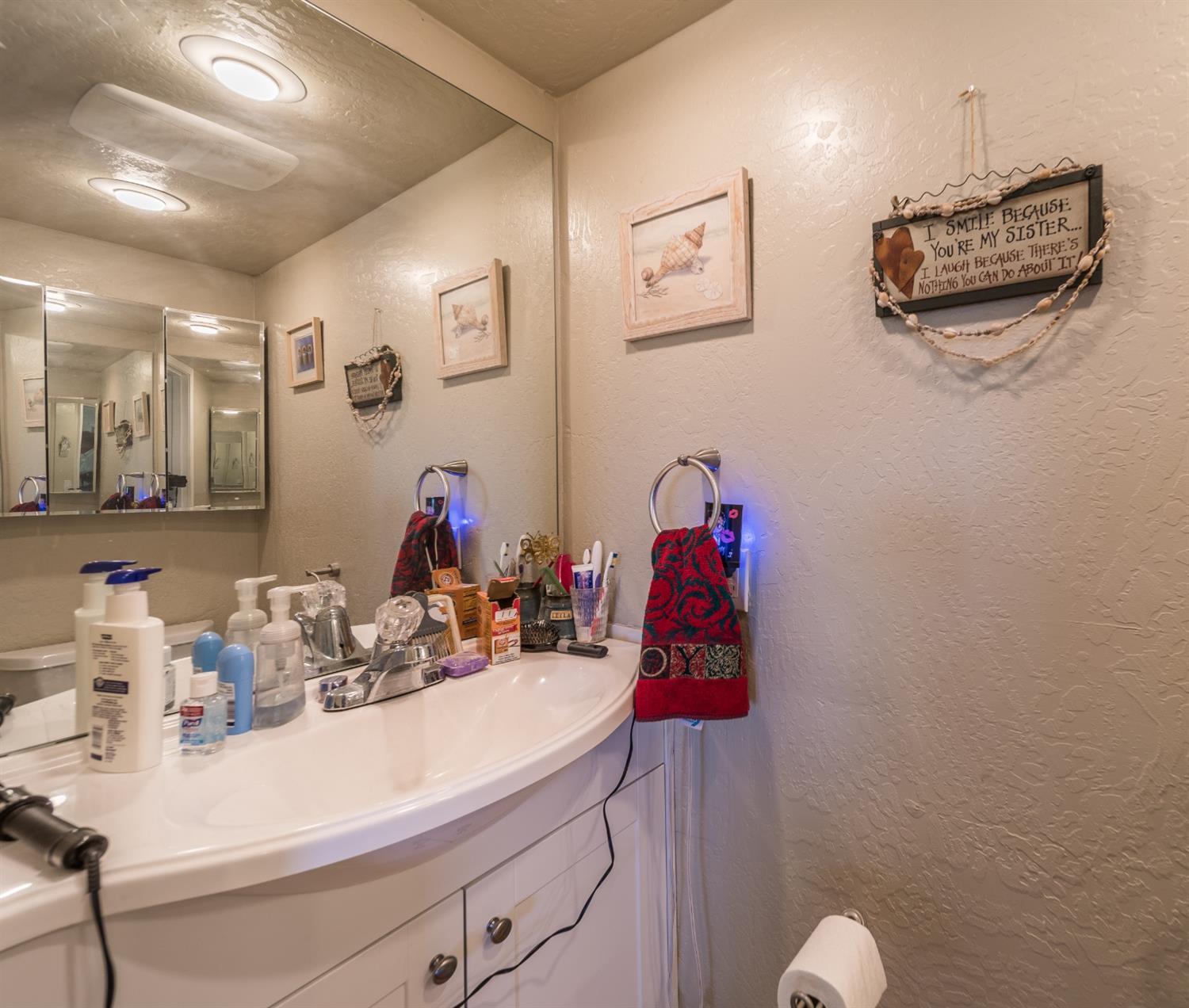 728 West Valley View Road Ashland, OR 97520 - Photo 18 of 32 a bathroom with a sink mirror and vanity