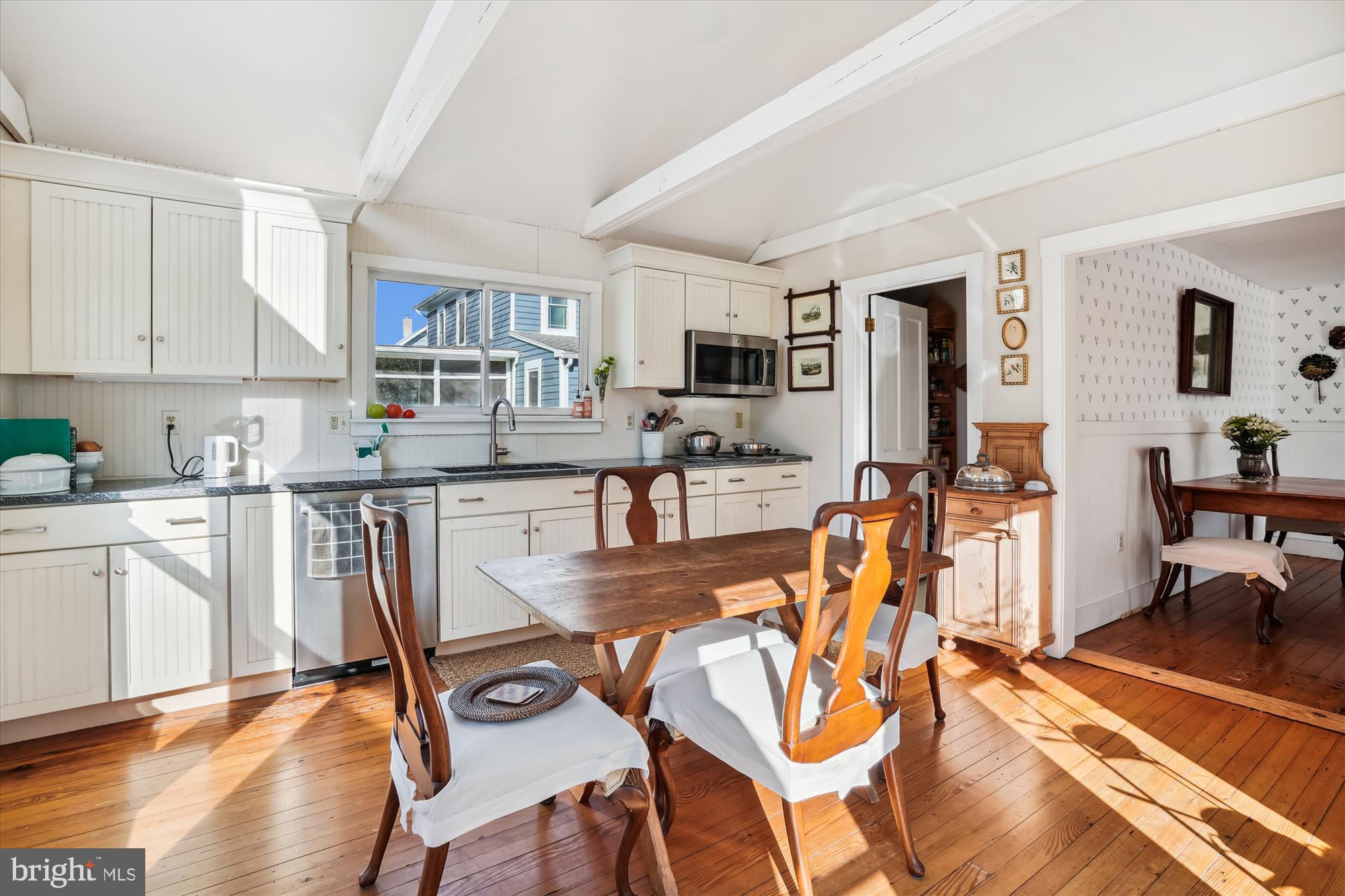 6394 Bozman Neavitt Road Neavitt, MD 21652 - Photo 12 of 26 a view of a kitchen with dining table and chairs