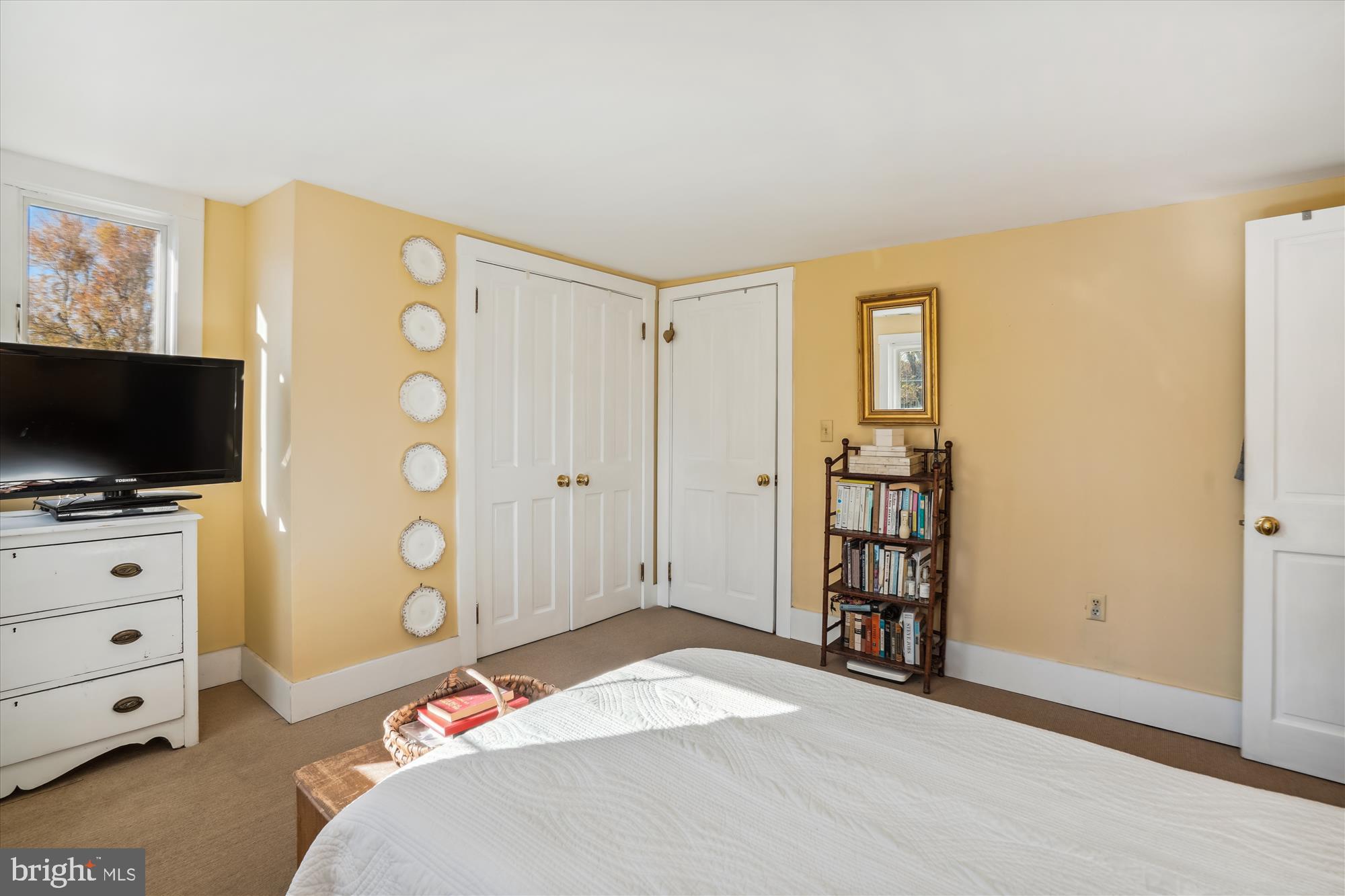 6394 Bozman Neavitt Road Neavitt, MD 21652 - Photo 17 of 26 a bedroom with a bed and a flat screen tv
