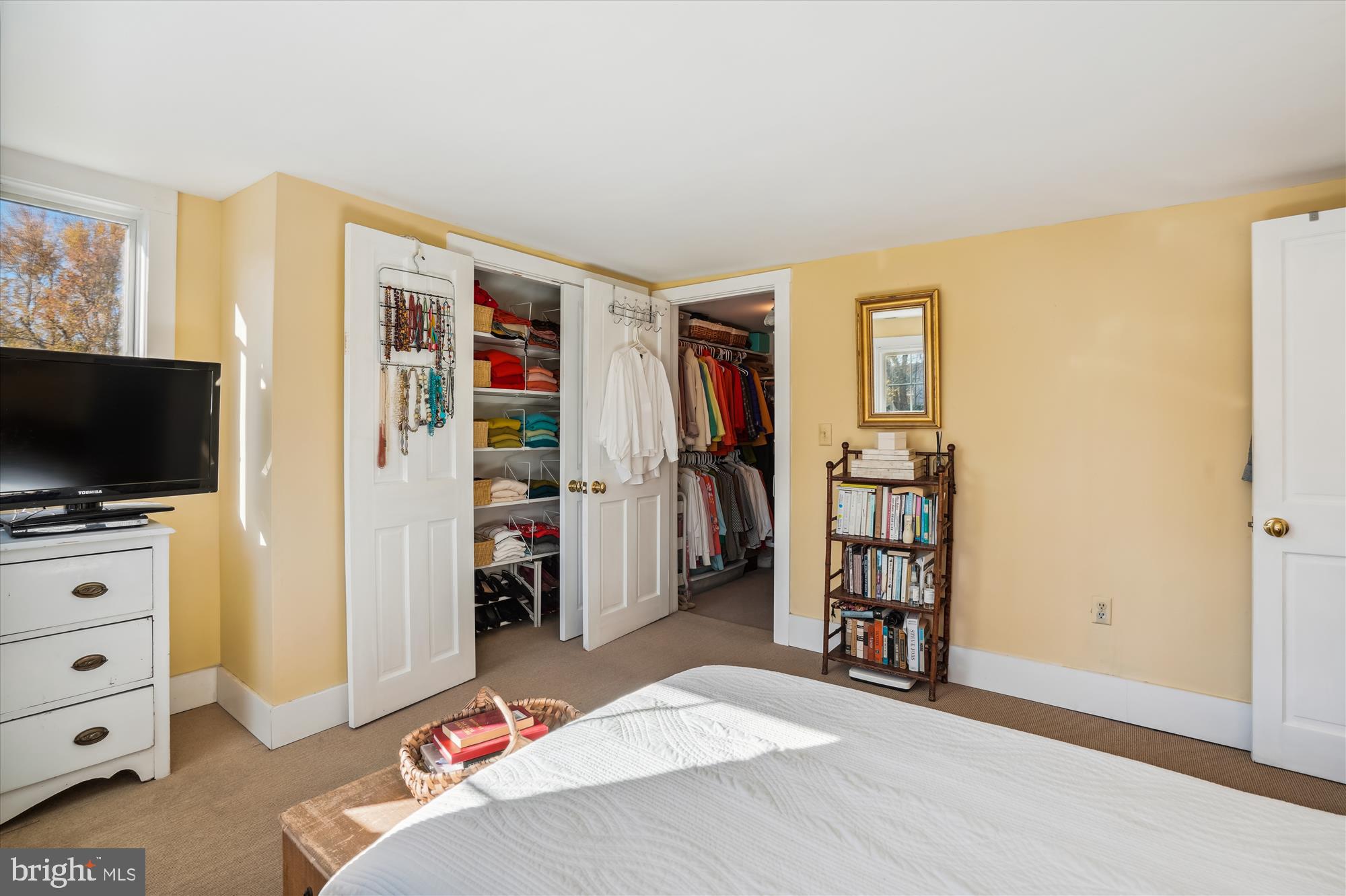 6394 Bozman Neavitt Road Neavitt, MD 21652 - Photo 18 of 26 a bedroom with a bed and a flat tv screen