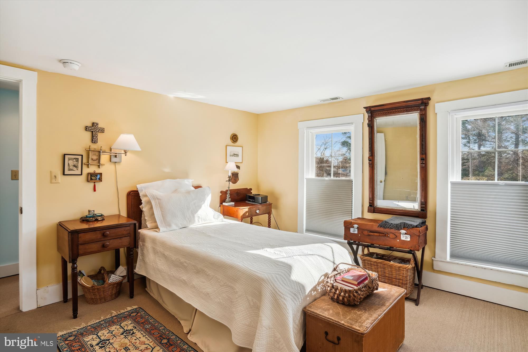 6394 Bozman Neavitt Road Neavitt, MD 21652 - Photo 19 of 26 a bedroom with a bed and wooden floor